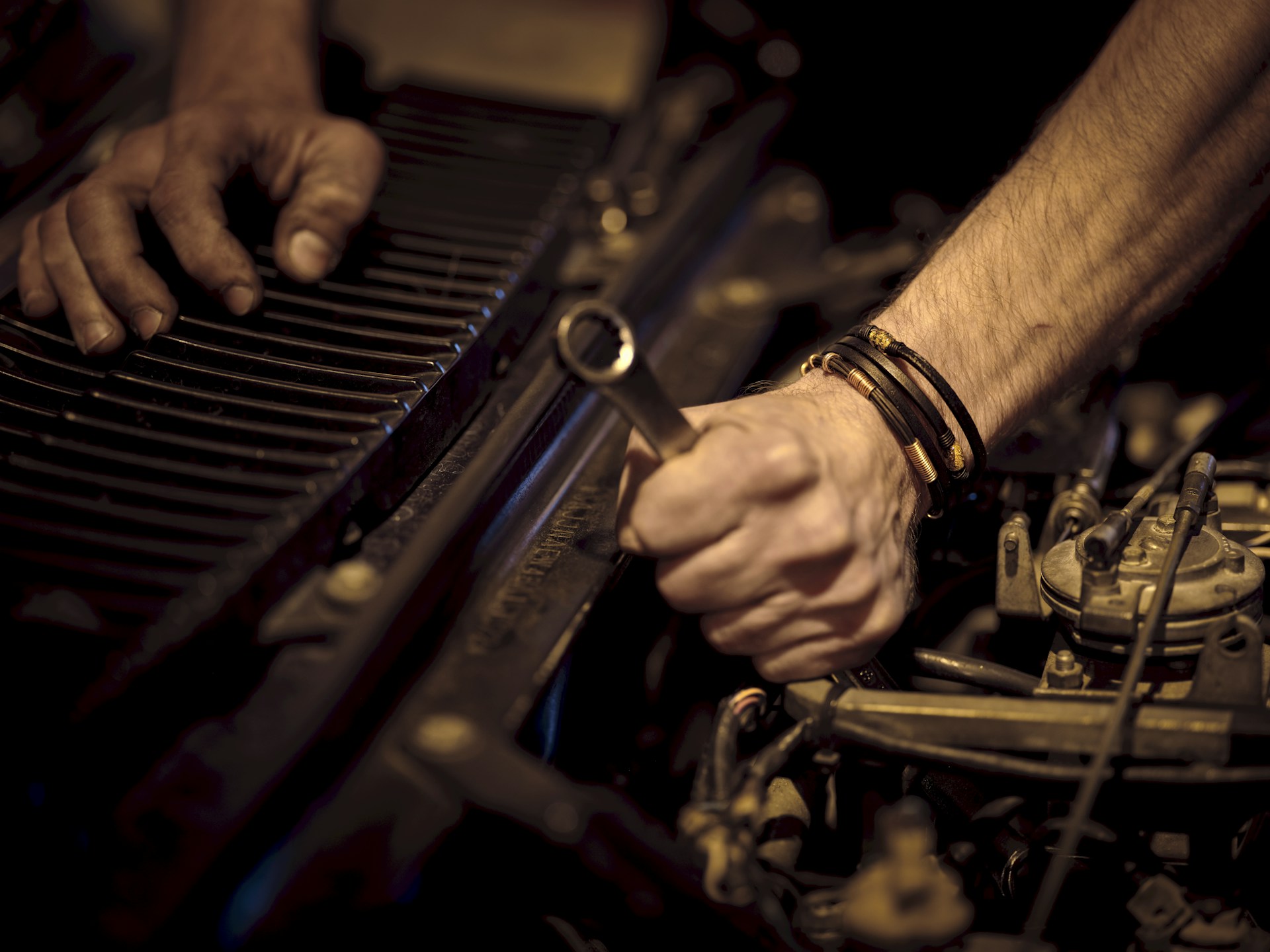 Mechanic working carefully inside a premium automotive workshop